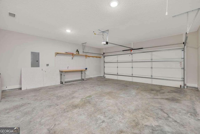 garage with baseboards, electric panel, visible vents, and a garage door opener