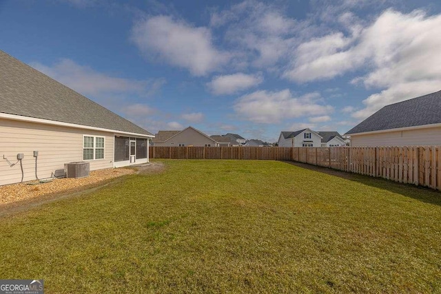 view of yard with cooling unit and a fenced backyard