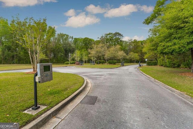 view of road featuring curbs