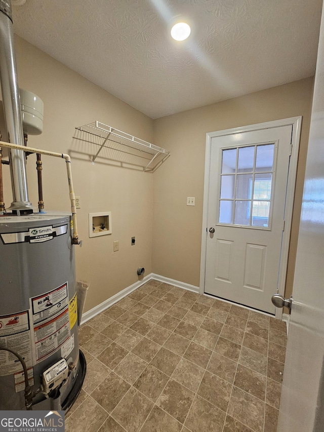 laundry area with laundry area, baseboards, hookup for an electric dryer, washer hookup, and gas water heater