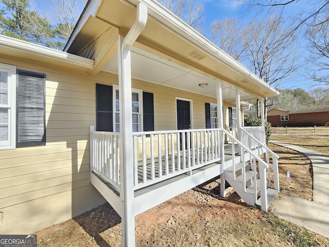 entrance to property with a porch