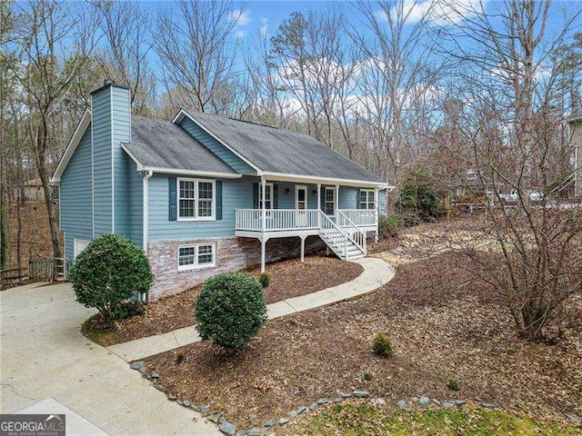 ranch-style home with covered porch and a chimney