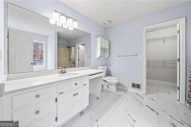 bathroom with toilet, marble finish floor, baseboards, and visible vents