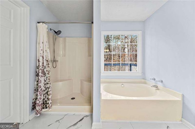 bathroom featuring a shower with curtain, a textured ceiling, and a bath