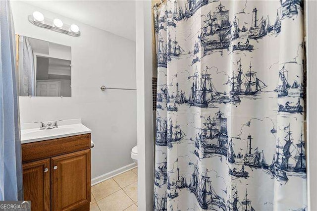 full bathroom featuring toilet, curtained shower, tile patterned flooring, and vanity