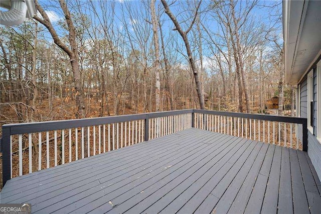 deck featuring a view of trees