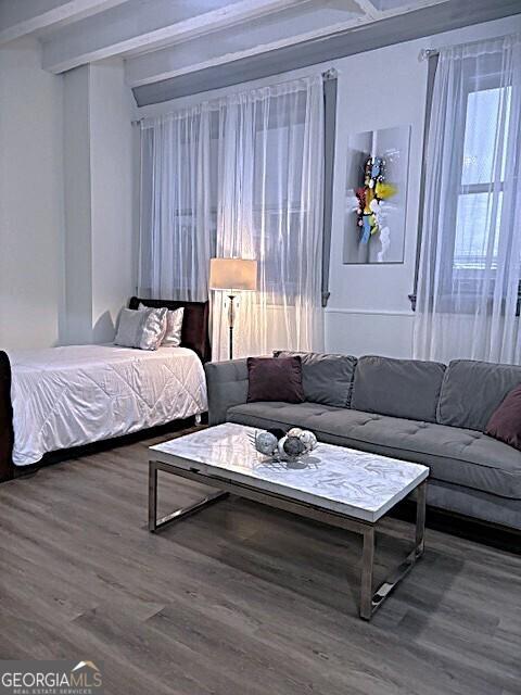 32 Peachtree St Unit 202, Atlanta, GA 30303 - bedroom featuring wood finished floors and beamed ceiling