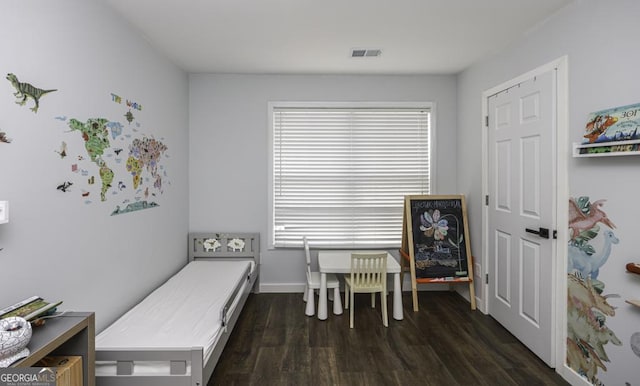 interior space featuring dark wood-style flooring, visible vents, and a healthy amount of sunlight