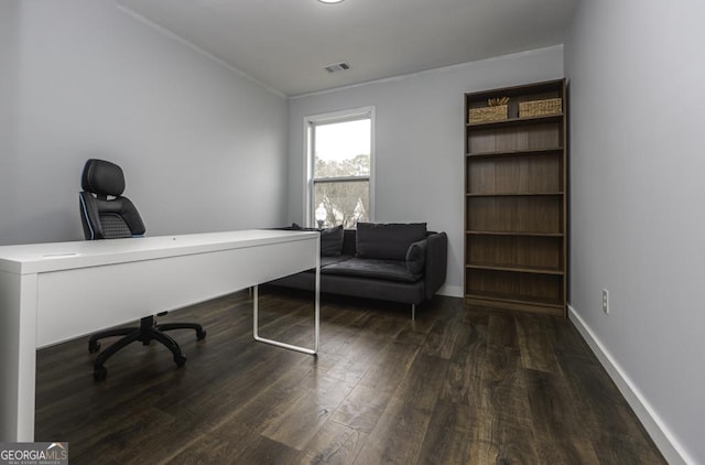 home office featuring wood finished floors, visible vents, and baseboards