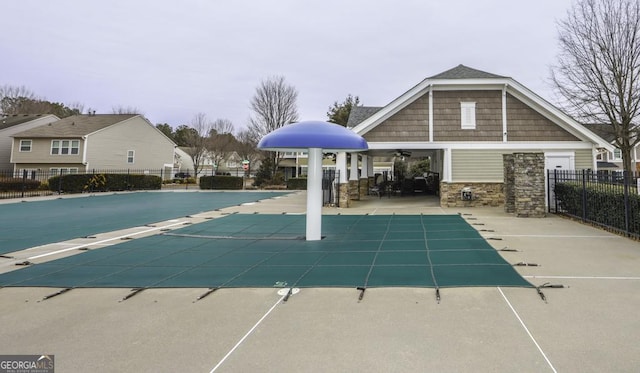 pool with ceiling fan, a patio area, and fence