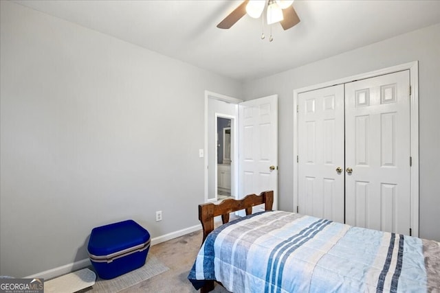 bedroom featuring a closet, baseboards, carpet, and a ceiling fan