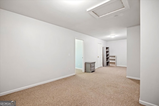 below grade area featuring baseboards and carpet flooring