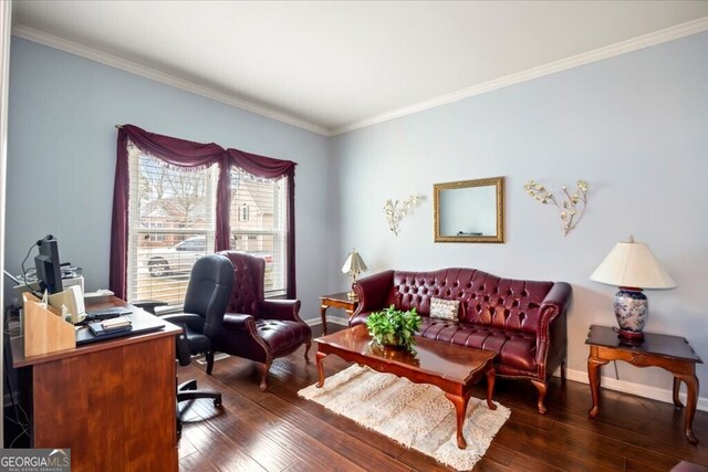 office space featuring hardwood / wood-style flooring, crown molding, and baseboards