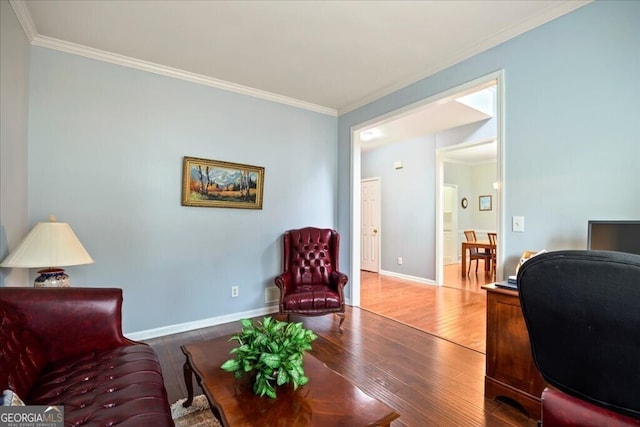 home office with crown molding, baseboards, and wood finished floors