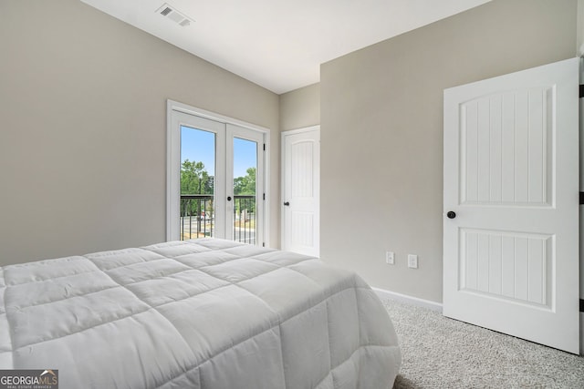 carpeted bedroom featuring access to outside, visible vents, baseboards, and french doors