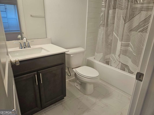 bathroom featuring marble finish floor, toilet, shower / bath combo, vanity, and baseboards