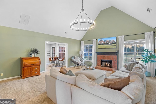 living area featuring visible vents, light carpet, and a healthy amount of sunlight