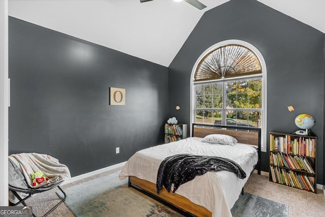 carpeted bedroom with lofted ceiling, a ceiling fan, and baseboards