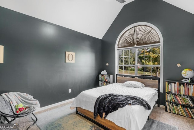 bedroom featuring high vaulted ceiling, baseboards, and carpet floors