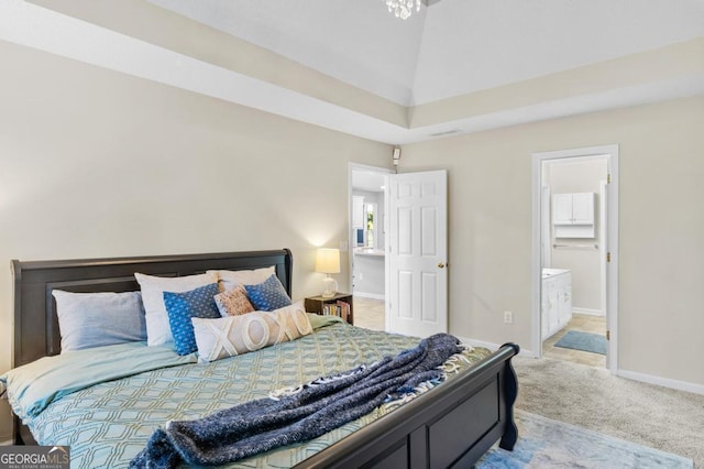 bedroom featuring lofted ceiling, carpet flooring, baseboards, and connected bathroom