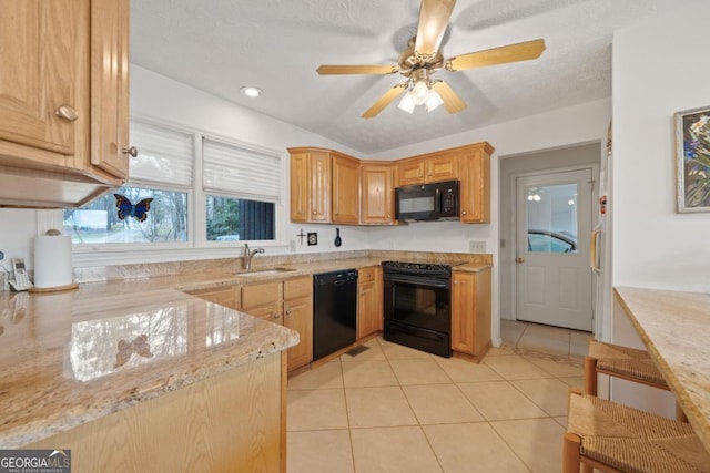 kitchen with light tile patterned floors, ceiling fan, a sink, light stone countertops, and black appliances