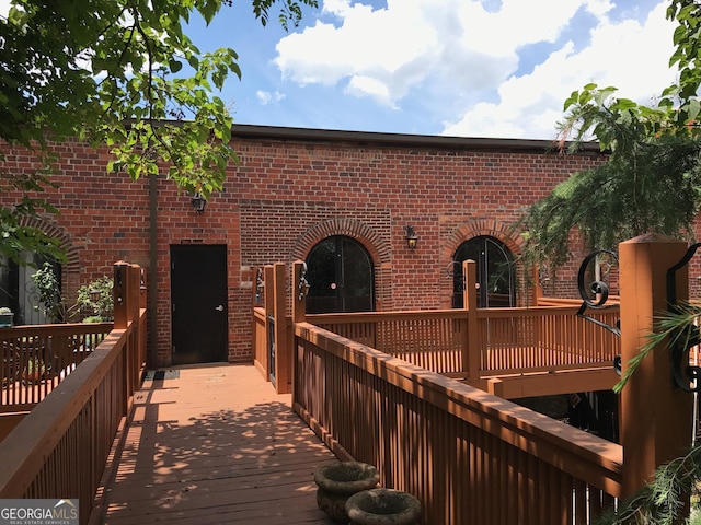 back of house with brick siding