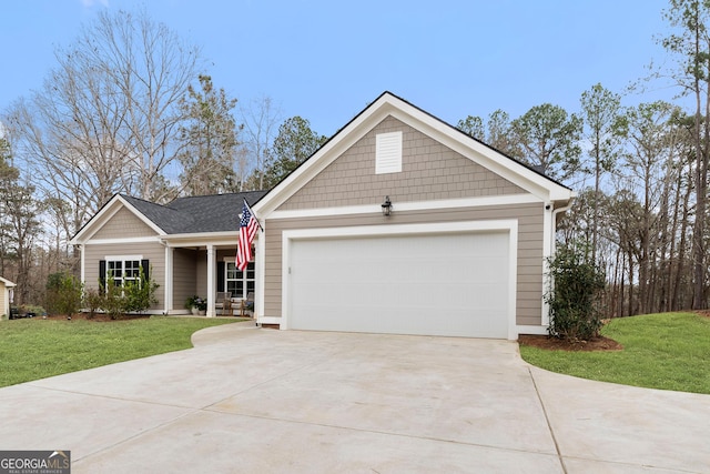 view of front facade with an attached garage, concrete driveway, and a front yard