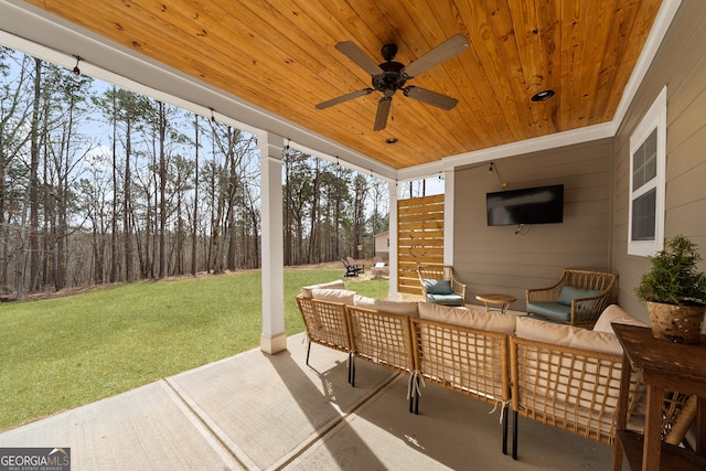 view of patio featuring an outdoor hangout area and a ceiling fan