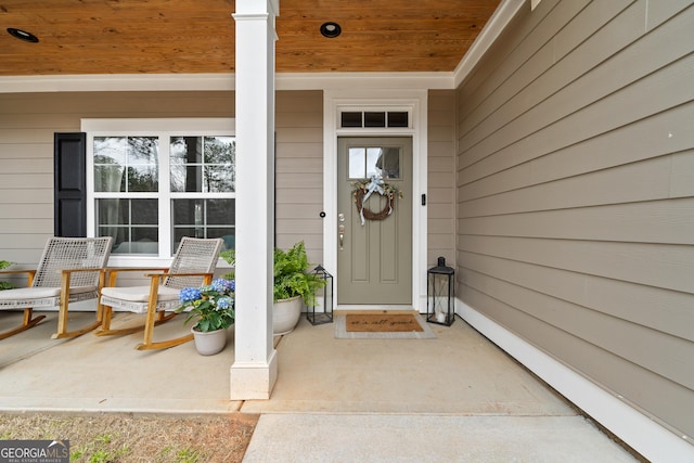 entrance to property featuring covered porch