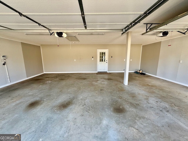 garage with a garage door opener and baseboards