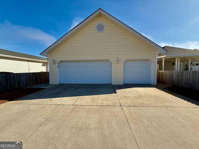 garage featuring fence