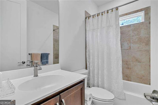 full bath with vanity, toilet, and shower / bathtub combination with curtain