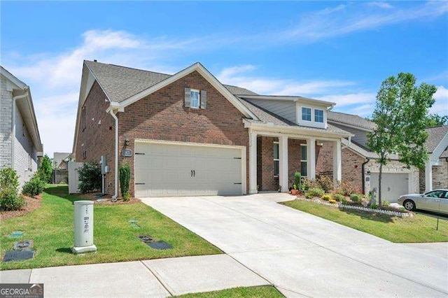 traditional home with a garage, driveway, a front lawn, and brick siding