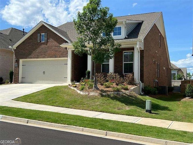 view of front of property featuring a front yard, brick siding, and driveway