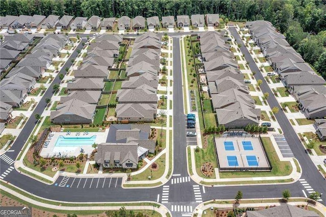 birds eye view of property with a residential view