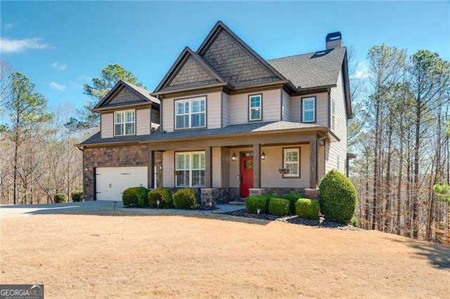 craftsman house featuring driveway, stone siding, a chimney, an attached garage, and a porch