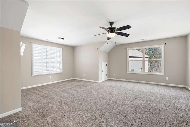 spare room with a ceiling fan, carpet, visible vents, and baseboards