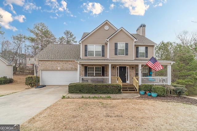 view of front facade with driveway, covered porch, a garage, brick siding, and a chimney