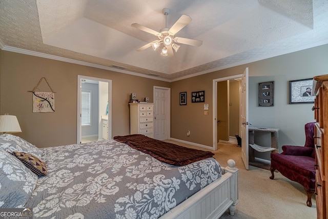 bedroom with visible vents, a tray ceiling, ornamental molding, a textured ceiling, and light carpet