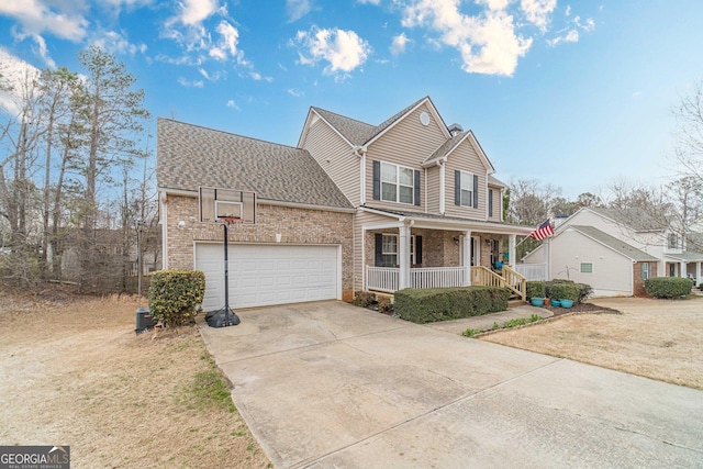 traditional home featuring driveway, covered porch, a shingled roof, a garage, and brick siding