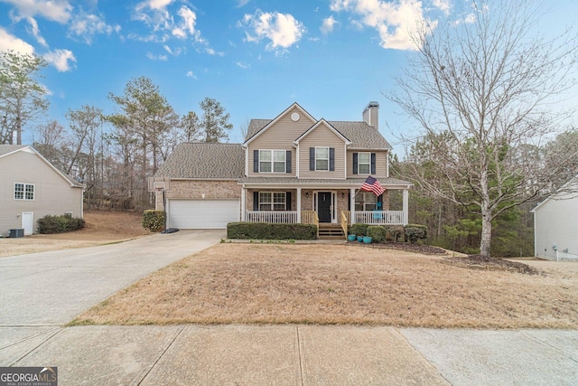 view of front of home with driveway, a porch, a garage, brick siding, and a chimney