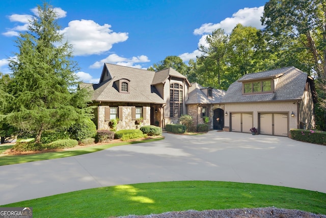 230 Hawks Lake Dr, Ball Ground, GA 30107 - french country home featuring driveway and roof with shingles