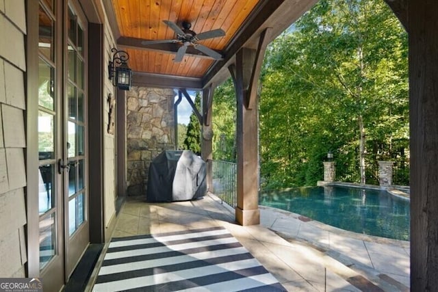 230 Hawks Lake Dr, Ball Ground, GA 30107 - unfurnished sunroom featuring ceiling fan and healthy amount of natural light