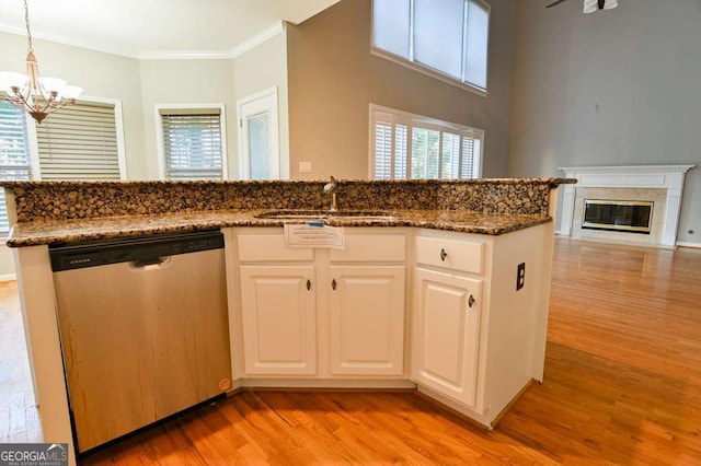 kitchen with a chandelier, light wood-style flooring, dishwasher, and crown molding