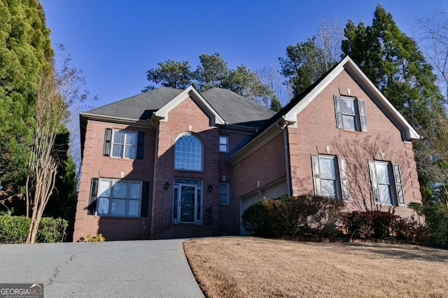 traditional-style house with brick siding