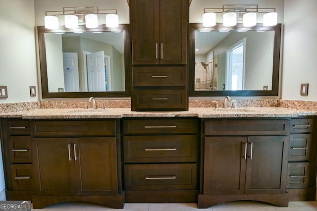 full bath with a sink and double vanity