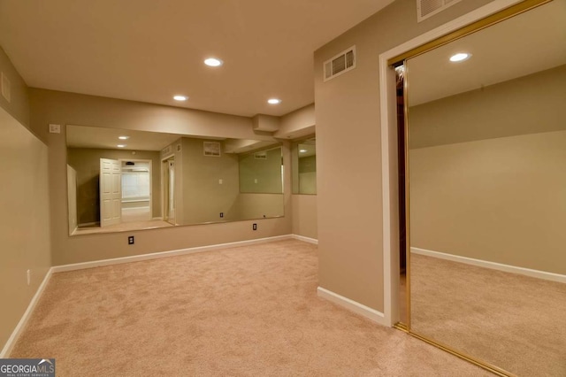 carpeted spare room with visible vents, recessed lighting, and baseboards