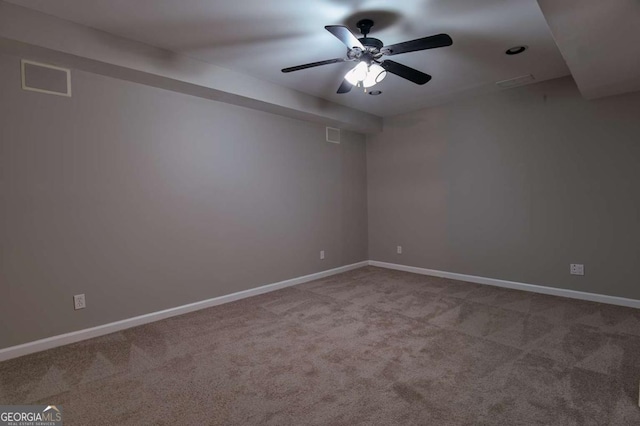 unfurnished room with carpet flooring, baseboards, and visible vents