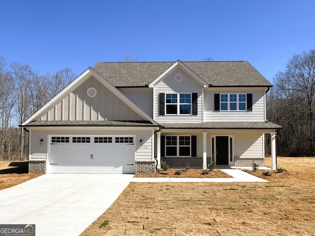 view of front facade with concrete driveway, brick siding, an attached garage, and covered porch