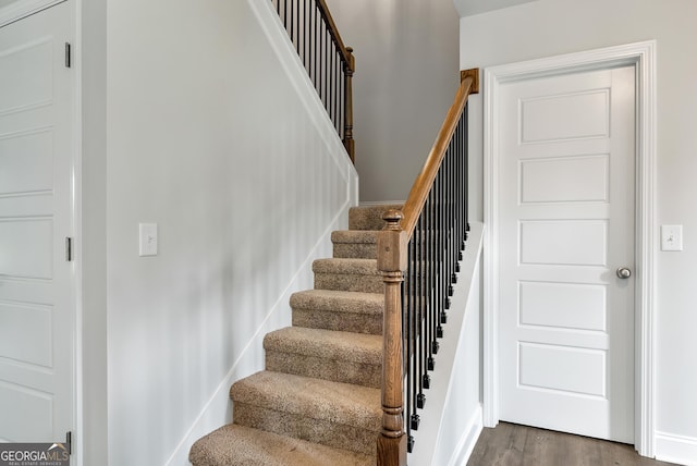 stairway featuring wood finished floors